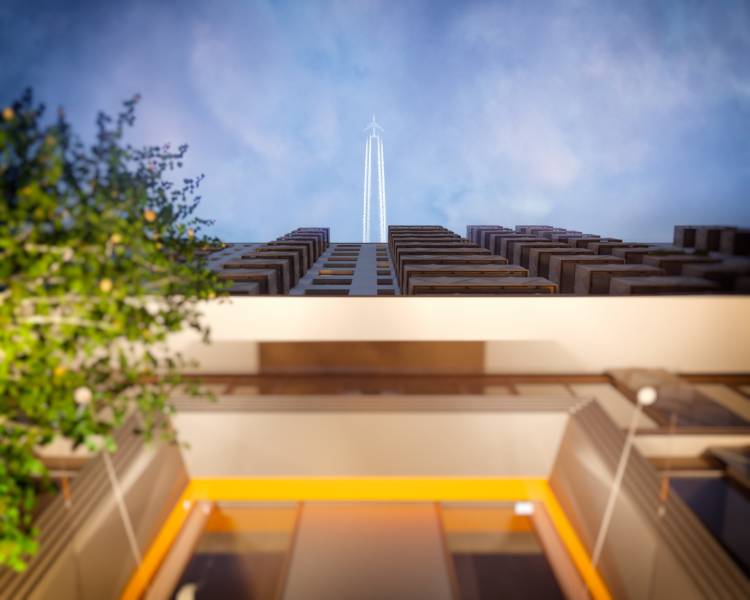 A view from below of a building with a flying airplane, Bratislava - Petržalka, Panónska cesta.