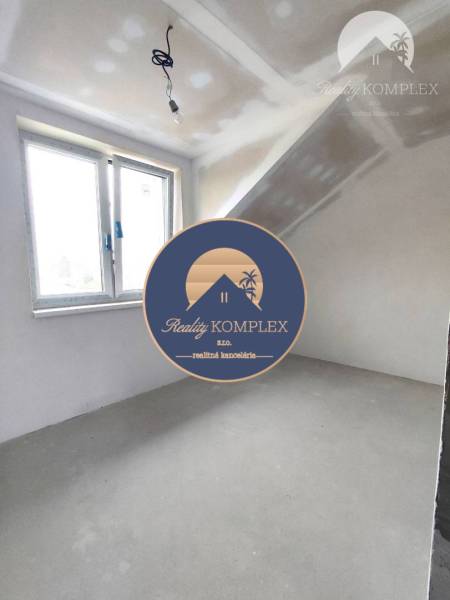 Unfurnished room with a window and a light bulb in a family house.