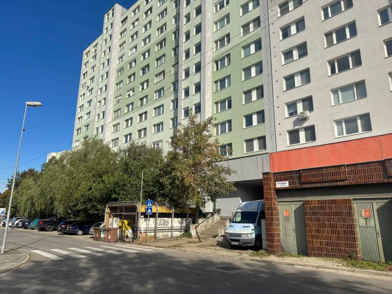 Apartment building on Strečnianska Street in Bratislava-Petržalka next to the parking lot.