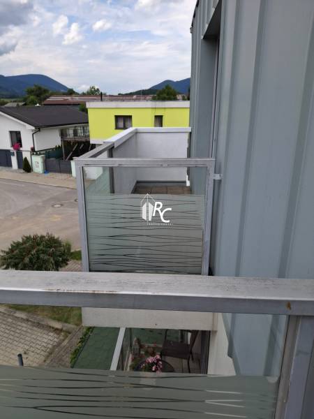 View from a 4-room apartment in Martin of the surrounding houses and mountains in the background.