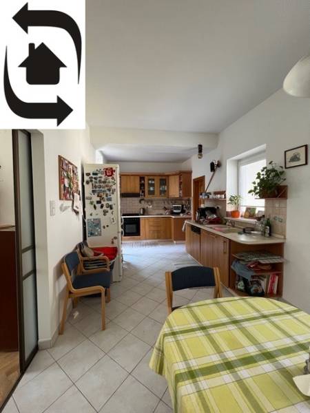 Kitchen with dining area, tiled floor, wooden furniture, 5 or more room apartment.