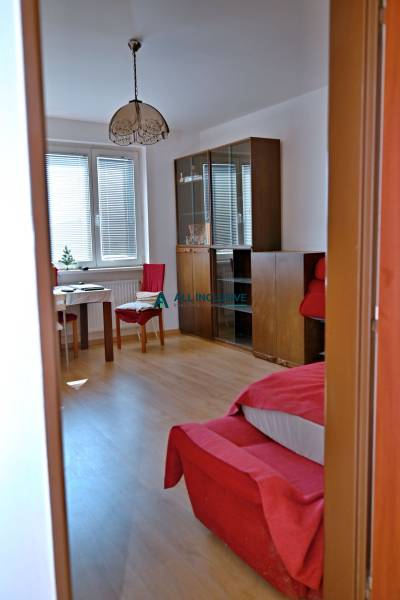 Living room in a 3-room apartment with seating and furniture, bright conditions.