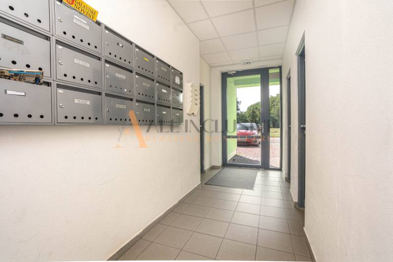 The entrance hall of an apartment building in Galanta with mailboxes on the side wall.