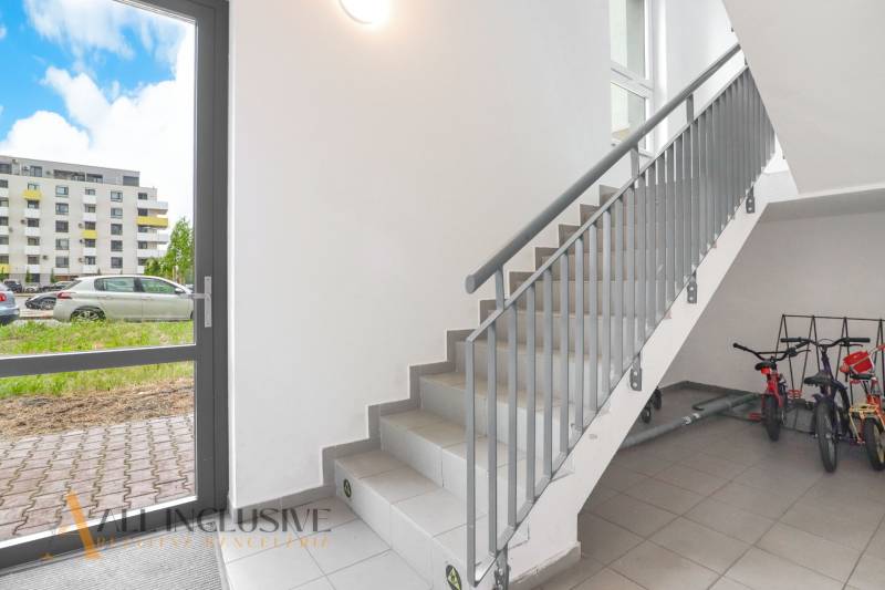 Staircase and parking lot in an apartment building in Galanta, Sereď, with children's bicycles.