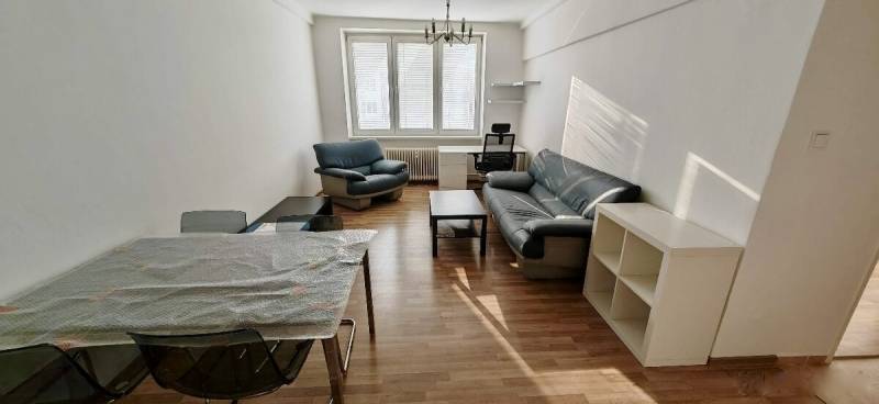 Living room with a sofa set and a table in a 2-room apartment.