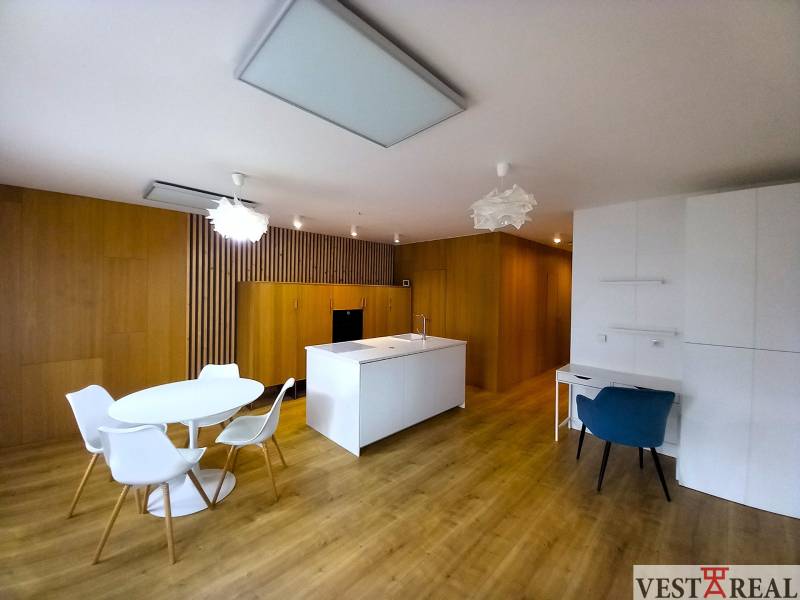 Kitchen in a family house with a dining table and wooden floors.