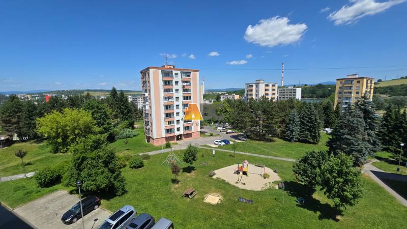 Housing estate panorama in Zvolen with a view of greenery and apartment buildings.