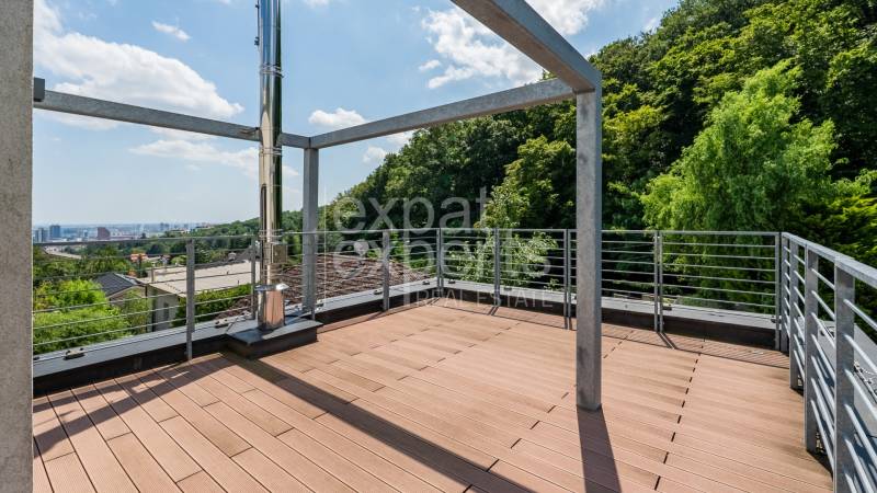 Wooden terrace on the roof of a family house on Sliačska Street, with a view of Bratislava-Ahoj.