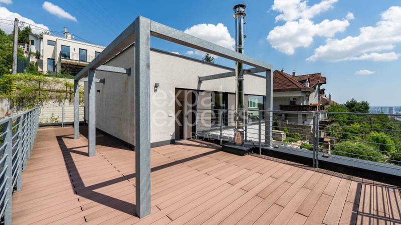 The terrace of a family house on Sliačska Street in Bratislava with a view of the city.