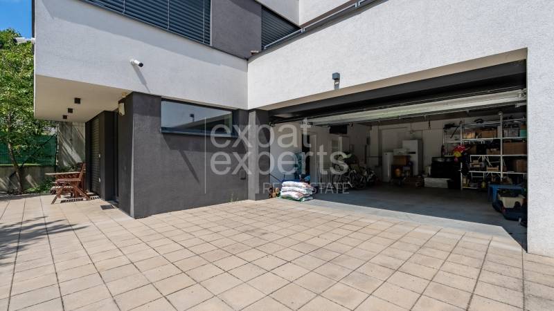 Family house on Sliačska Street in Bratislava - Ahoj with an open garage.