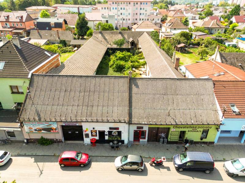 Unusual properties on P. O. Hviezdoslav Street in Nové Mesto nad Váhom, surrounded by houses.
