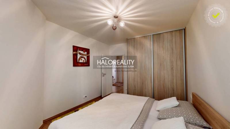 Bedroom in a 3-room apartment with a bed and a built-in wardrobe.
