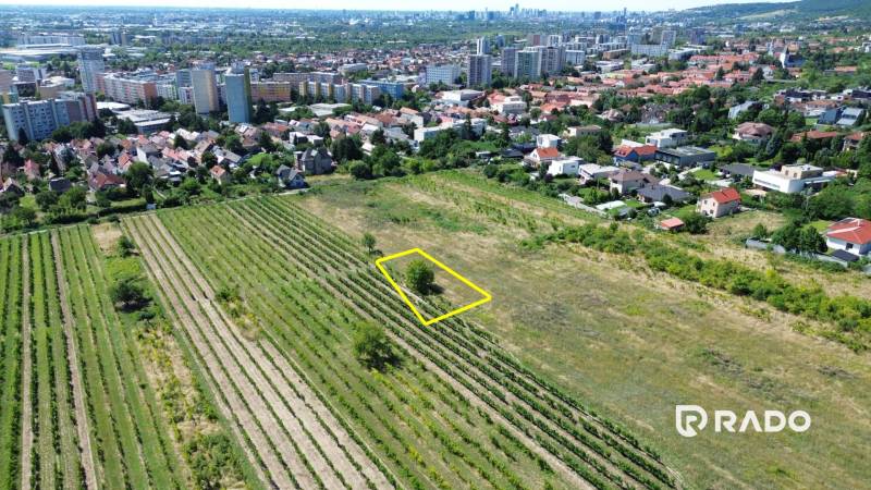 Aerial view of residential plots in Bratislava - Rača with a view of the city.