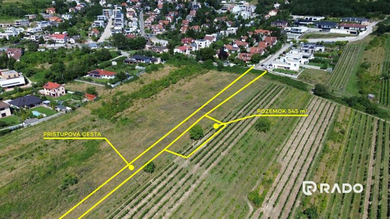 Plots - housing in Bratislava, Rača, with an access road and surroundings of houses.