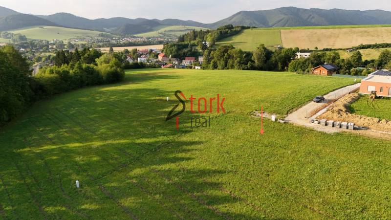 Plots - living in Kľače surrounded by greenery and hilly landscape.