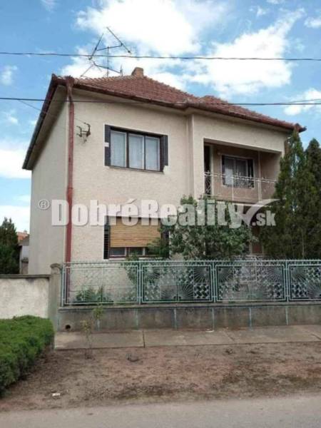 A family house in Dvory nad Žitavou on Dvory nad Žitavou street with a metal fence.