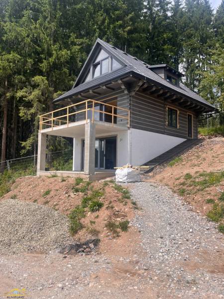 A cottage in Korňa surrounded by forest with a terrace in the middle of nature for sale.