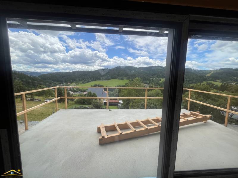A view from the cottage in Korňa of the picturesque landscape with meadows and forests.