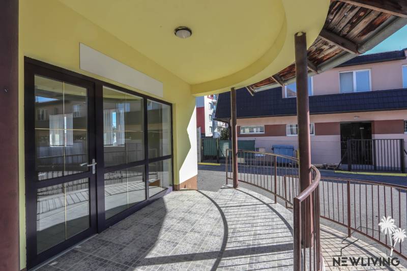 Exterior of commercial premises on Slovenského národného povstania Street in the town of Vrbové, covered terrace.
