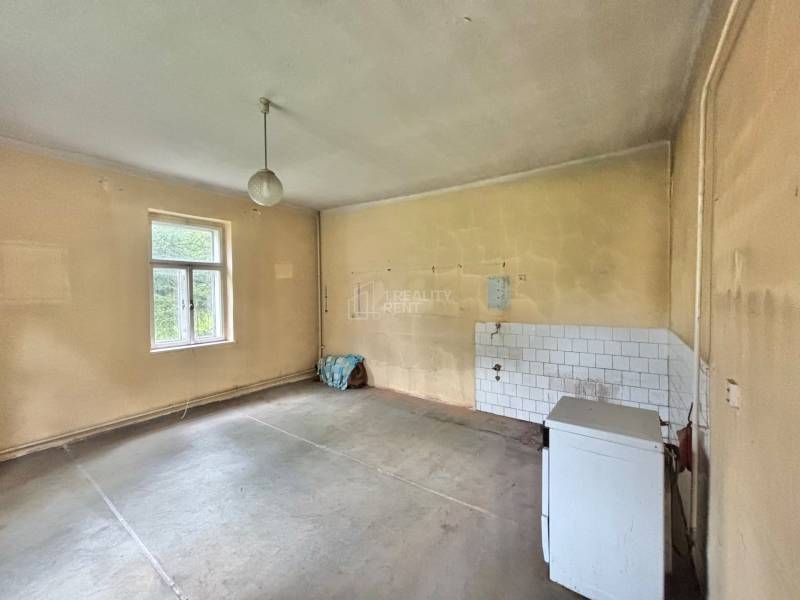 Empty room in a family house with a window and simple decoration.