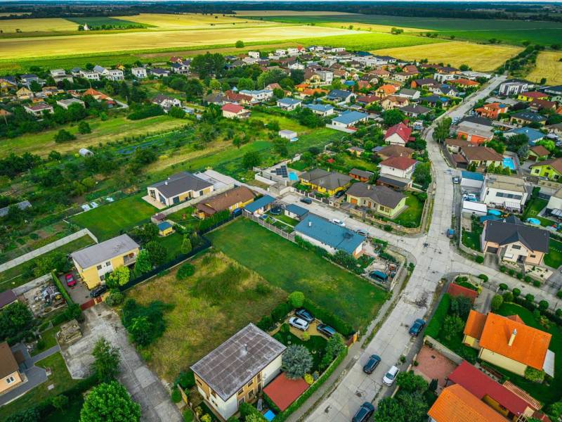 Aerial view of Priemyselná Street in Nová Dedinka, surrounding plots and houses, Residential plots.
