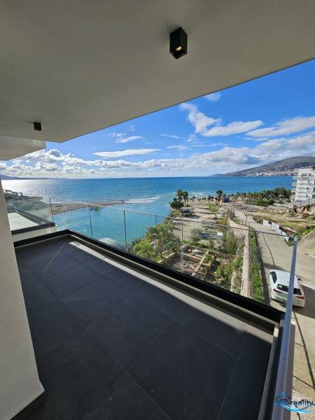 View from the terrace of a holiday apartment in the city of Sarandë overlooking the coast and the sea.