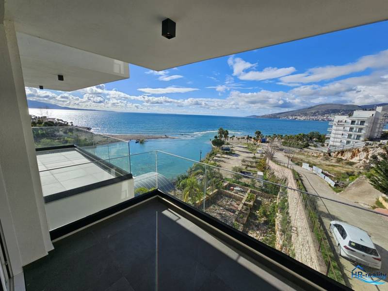 Balcony of a holiday apartment in Sarandë with a view of the sea and coastal landscape.