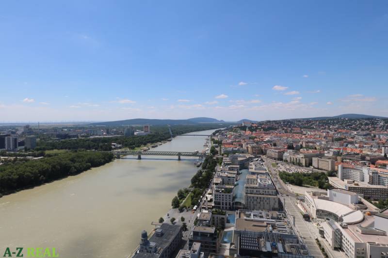 View of the Danube River and buildings in Bratislava - Old Town from Pribinova Street.