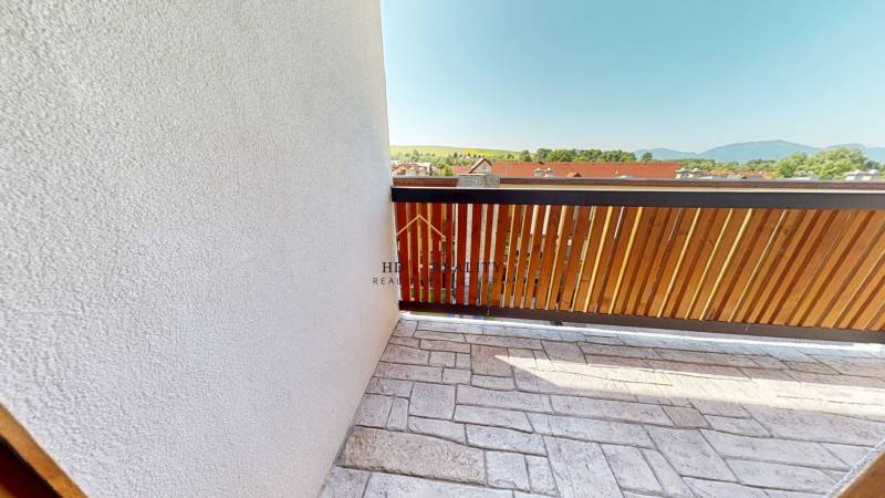 Balcony of a 2-room apartment in Demänovská Dolina with a view of the natural scenery.