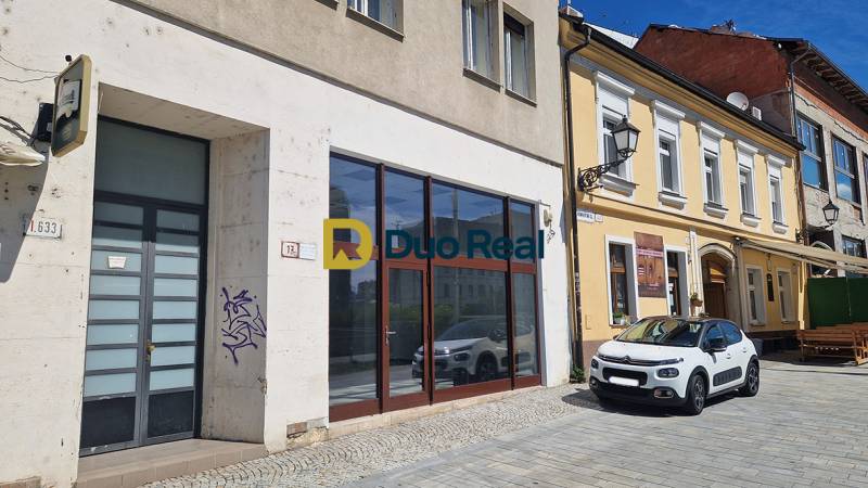 Commercial premises on Konventná Street, Bratislava - Old Town near a parked car.