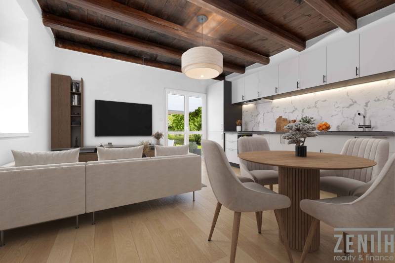 Living room with a wooden ceiling, kitchen, and dining area in a family house.