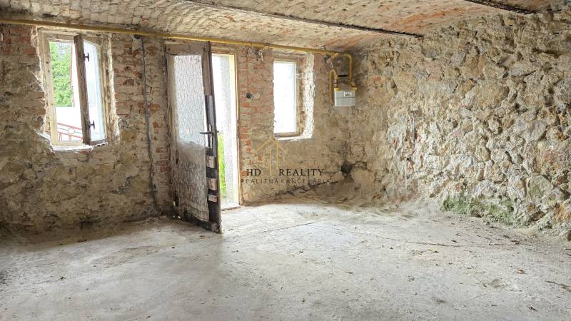 Stone walls, windows, doors, spacious room in a family house.