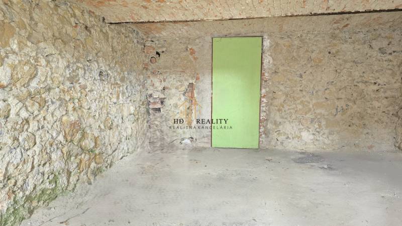 Stone walls with exposed bricks and doors in a family house.