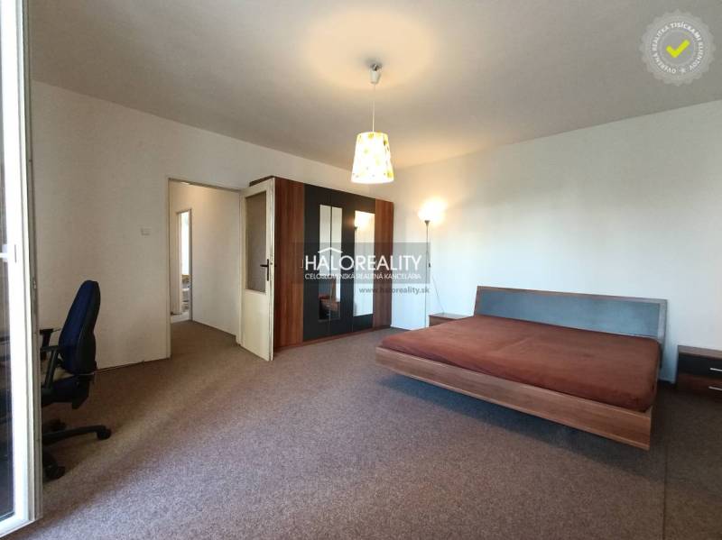1-bedroom apartment with a spacious bed and wardrobe, rear entrance available.