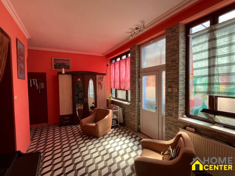 Interior of a family house with striking walls and geometric flooring.