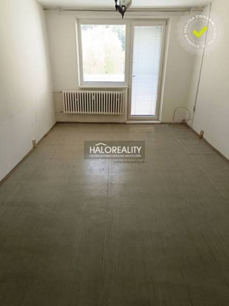 Empty room with a plastic window and door in a one-room apartment.