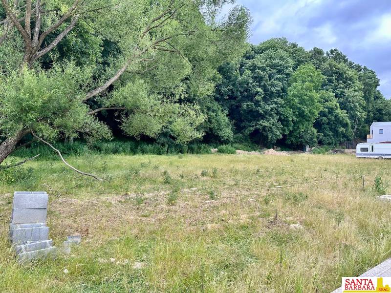 A building plot in Borinka surrounded by trees, ideal for living in nature.