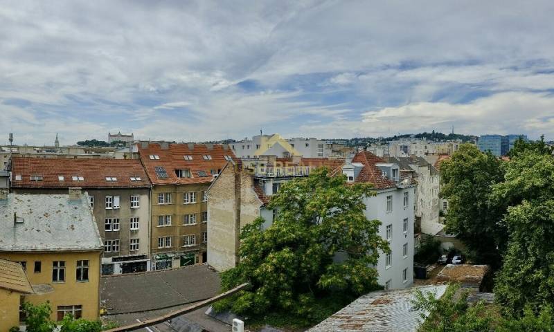 A view of the rooftops and greenery in Bratislava, Old Town on Špitálska Street.