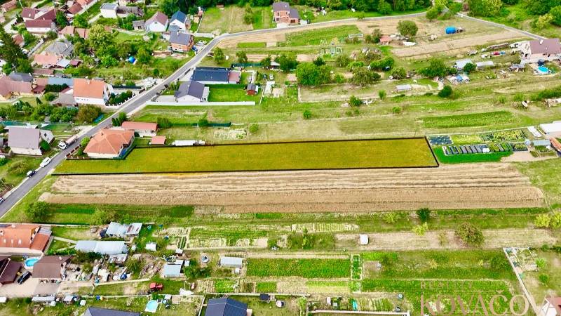 Panoramic view of residential plots in Trenčianske Jastrabie surrounded by houses.