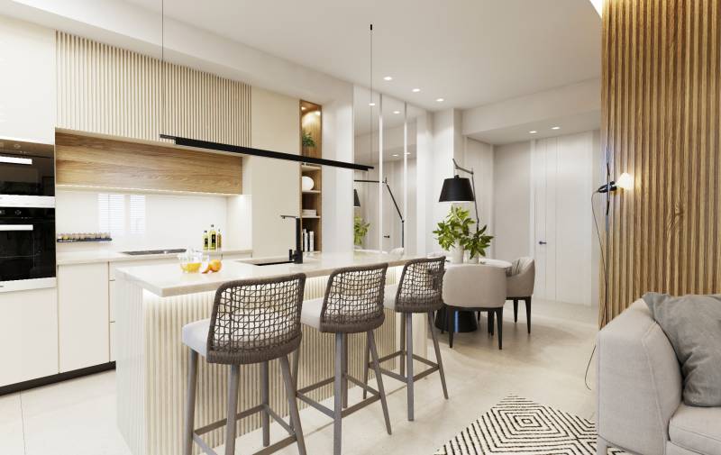 A kitchen with a dining table and a bar counter in a 3-room apartment.