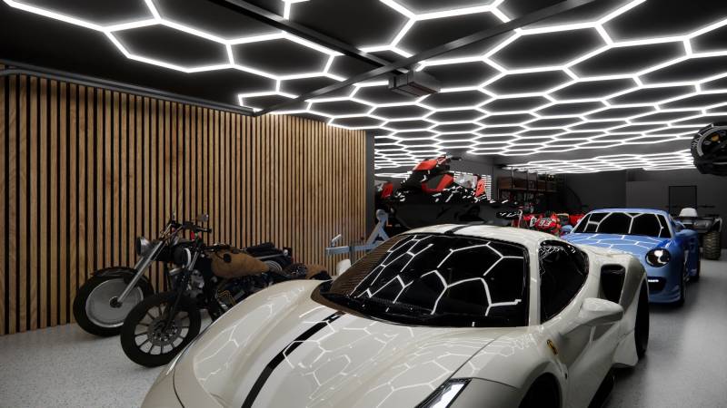 Showrooms with cars, motorcycles, and unique ceiling lighting in the garage.