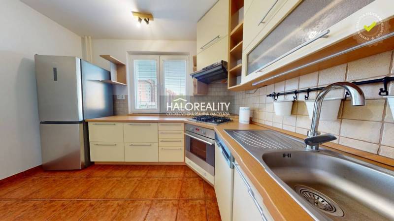 A kitchen in a 4-room apartment with a gas stove and a dishwasher.