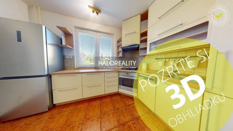 Kitchen in a 4-room apartment with equipment and a view from the window.