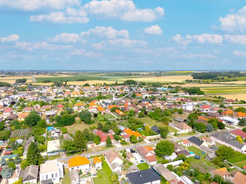A view of family houses in Čierna Voda, surrounded by nature and road infrastructure.
