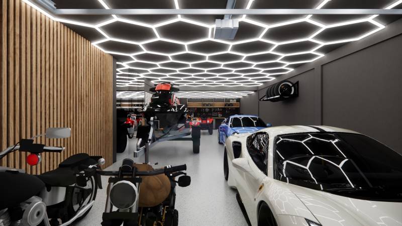 Garages with luxury vehicles and modern lighting.