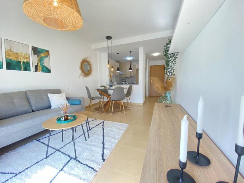 Living room in a 3-room apartment with comfortable seating and a dining area.