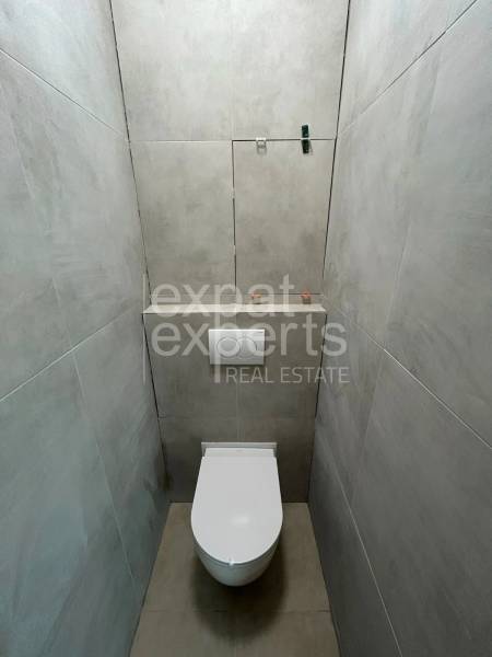 Bathroom spaces in a 2-room apartment with a toilet and tile cladding.
