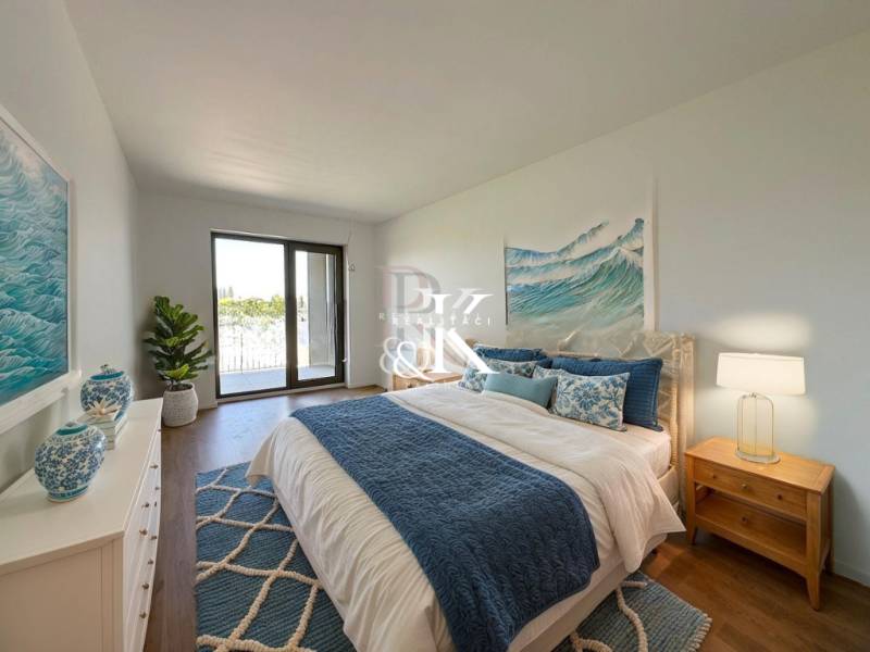 A bedroom in a 2-room apartment with a brisk touch of blue and white.