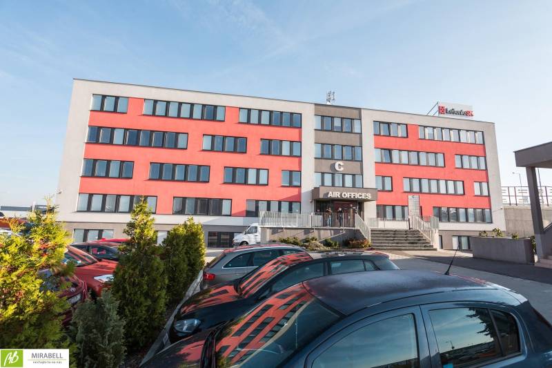 Office building on Pestovateľská Street in Bratislava - Ružinov with a parking lot and staircase.