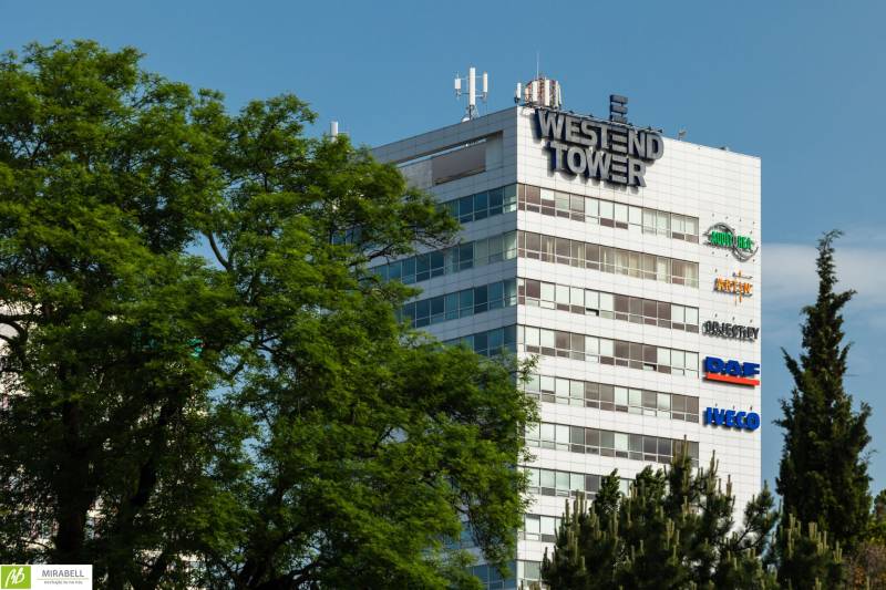 Westend Tower building among the trees on Dúbravská cesta in Bratislava - Karlova Ves.